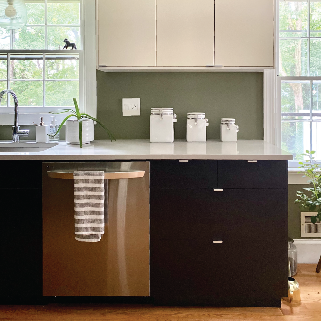 Photo of kitchen including the kitchen sink, kitchen cabinets, and dishwasher.